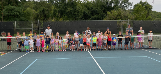 Junior Development tennis players on an outdoor court